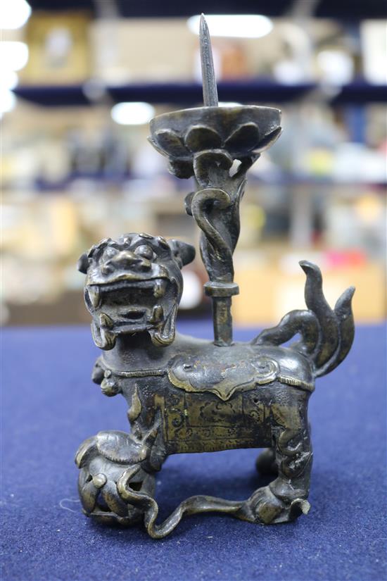 A Chinese bronze lion pricket candlestick, late Ming dynasty